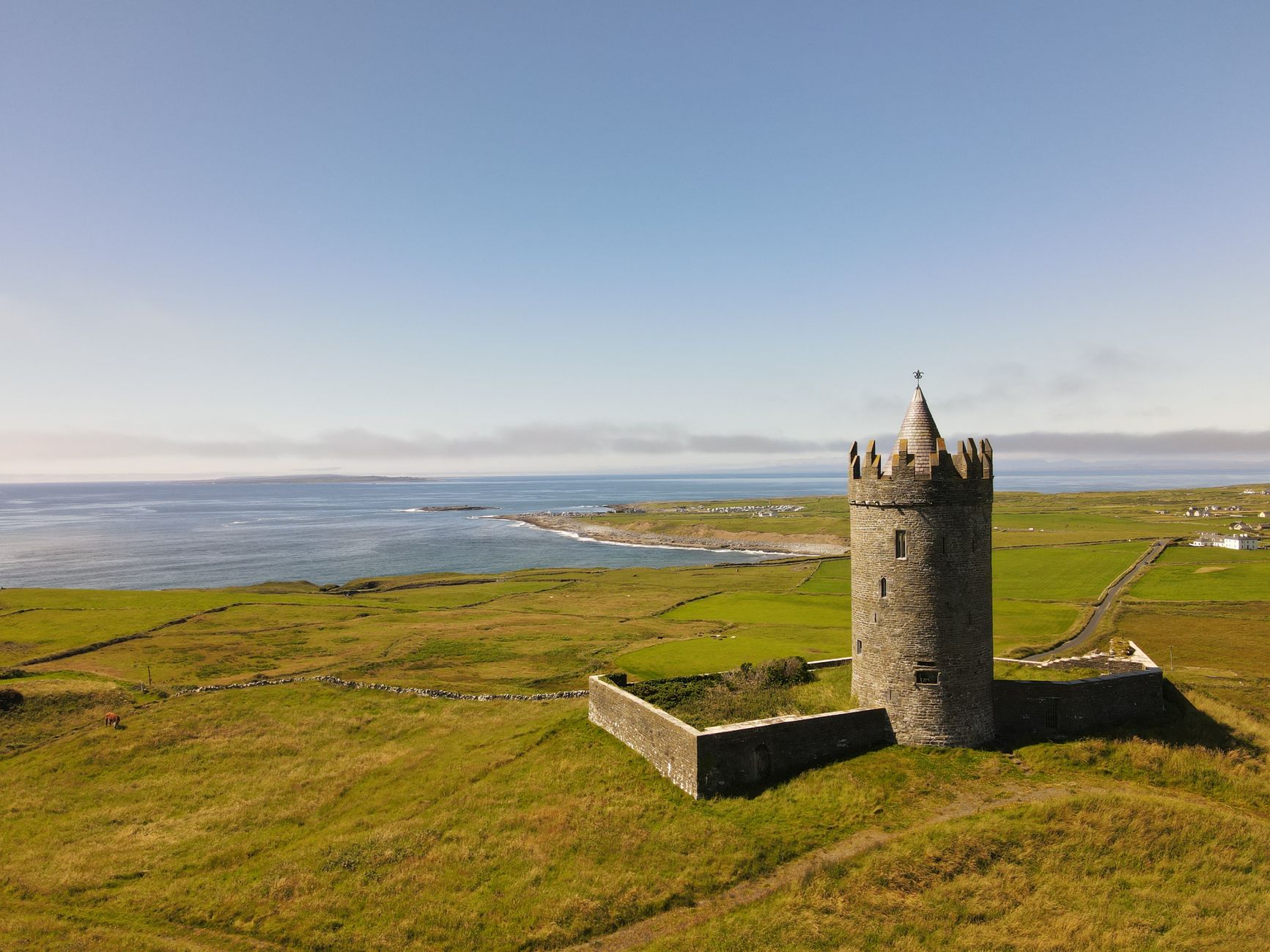 doonagore castle on green grass field